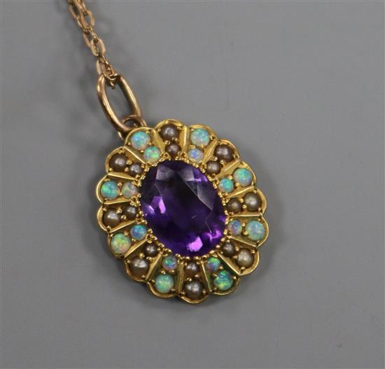 An Edwardian yellow metal, white opal, seed pearl and amethyst oval pendant (converted brooch) on a 9ct gold chain, pendant 19mm.